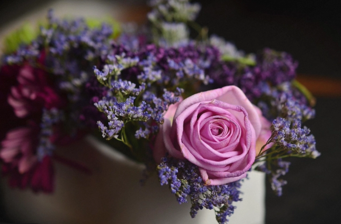 Two Signature-size bouquets from different seasons side by side